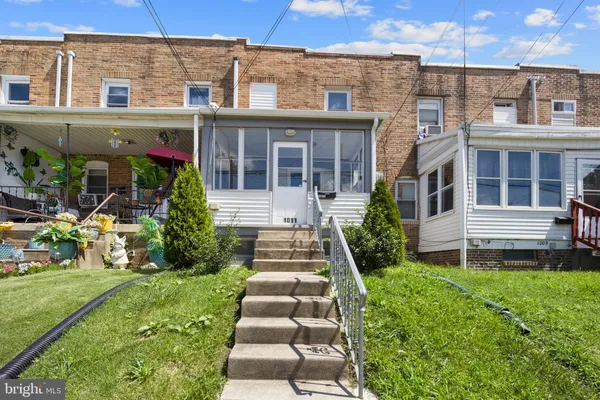 front view of a building with a yard