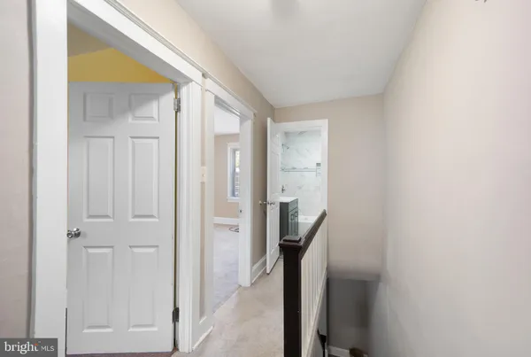 a view of a bathroom from a hallway