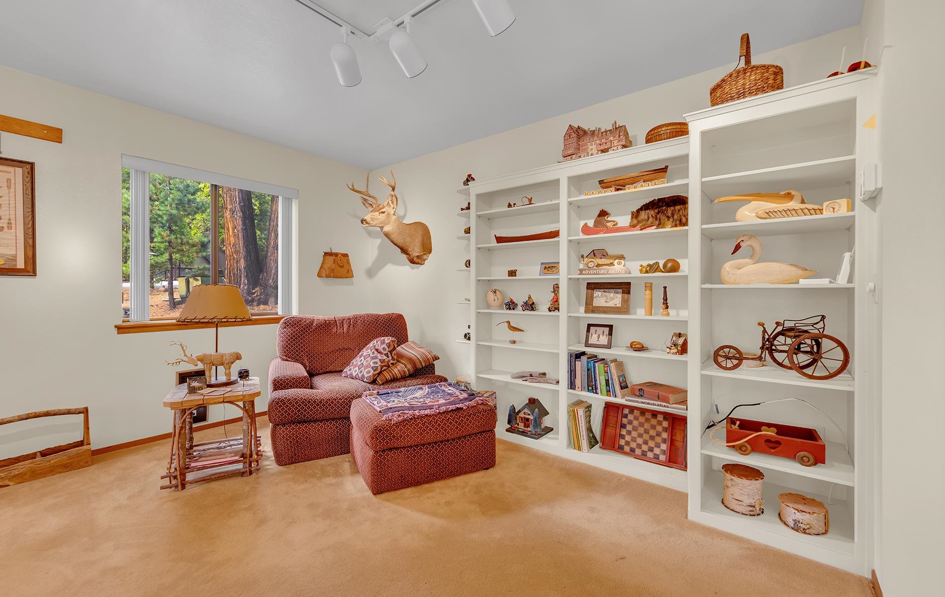 608 East Burnt Cedar Road Lake Almanor, CA 96137 - Photo 6 of 36 a living room with furniture and a book shelf