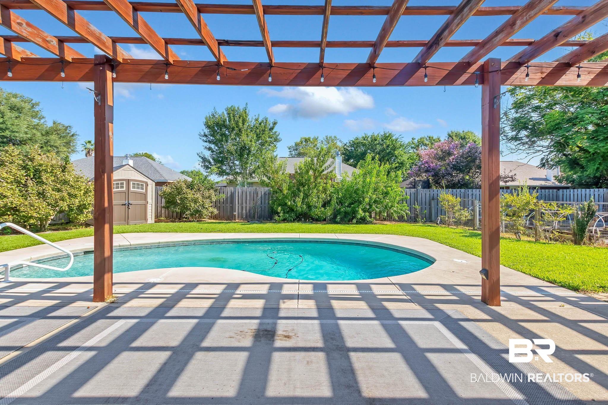 9607 Czar Court Fairhope, AL 36532 - Photo 37 of 42 View of swimming pool with a shed, a pergola, and a patio area