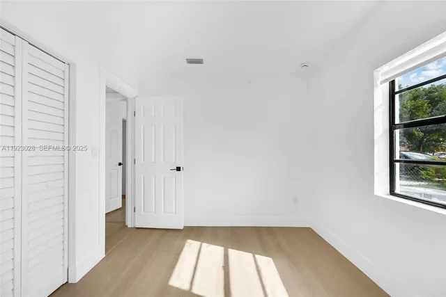 a view of a room that has a window in it