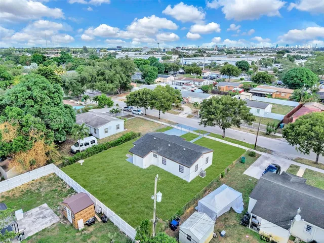 an aerial view of a house with a garden