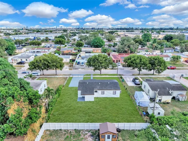 an aerial view of a house with a garden