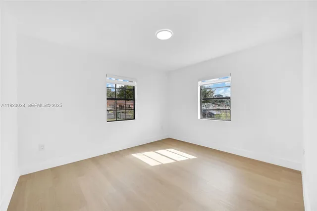 an empty room with windows