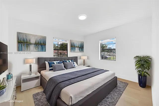 a bedroom with a large bed and a couch