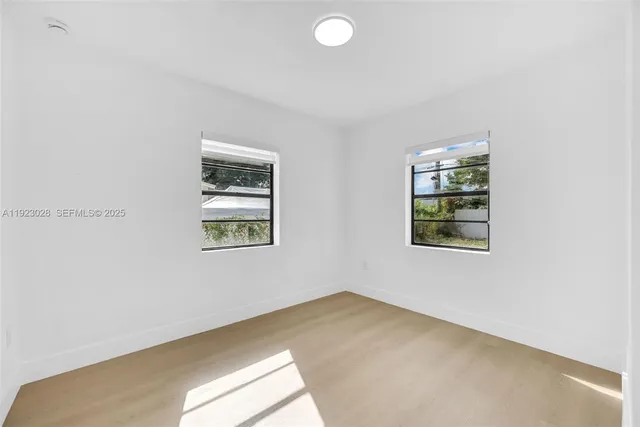 an empty room with windows