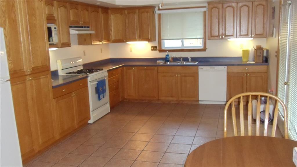 231 Bebout Road Venetia, PA 15367 - Photo 9 of 13 Large Kitchen with plenty of storage. Leads out to deck area.