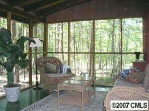3492 Rhyne Forest Road Iron Station, NC 28080 - Photo 4 of 8 a living room with furniture and a floor to ceiling window