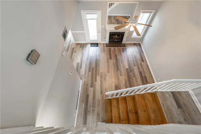 wooden floor in an empty room with a window