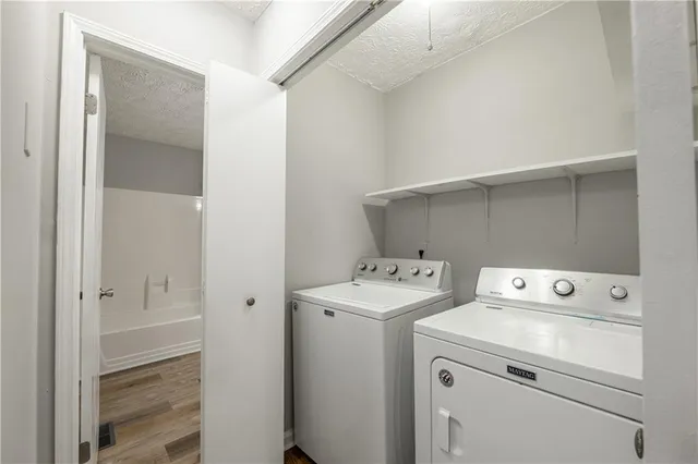 a view of a livingroom with a fireplace and window
