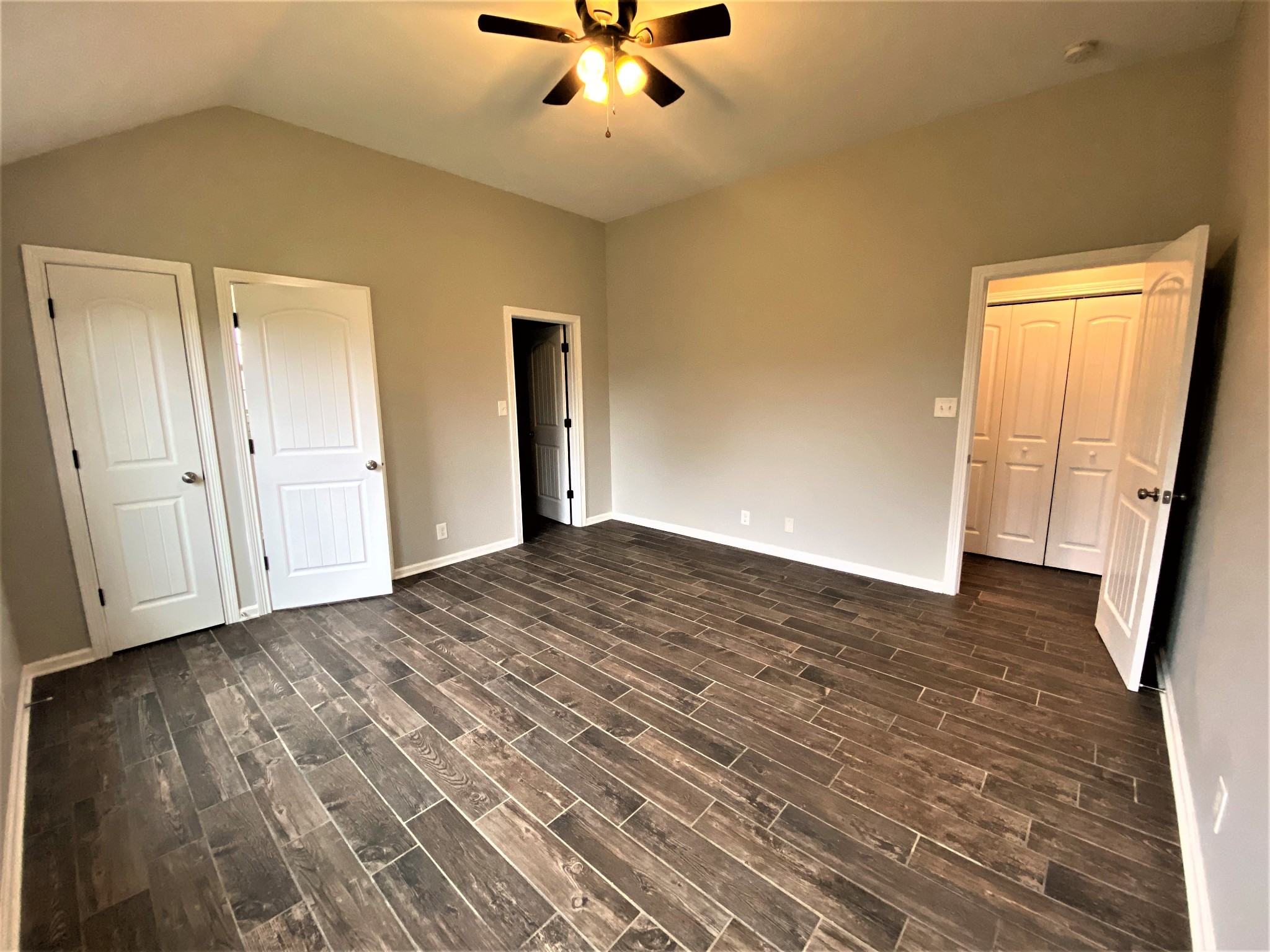 4200 Station Road Cunningham, TN 37052 - Photo 11 of 37 a view of a livingroom with wooden floor and a ceiling fan