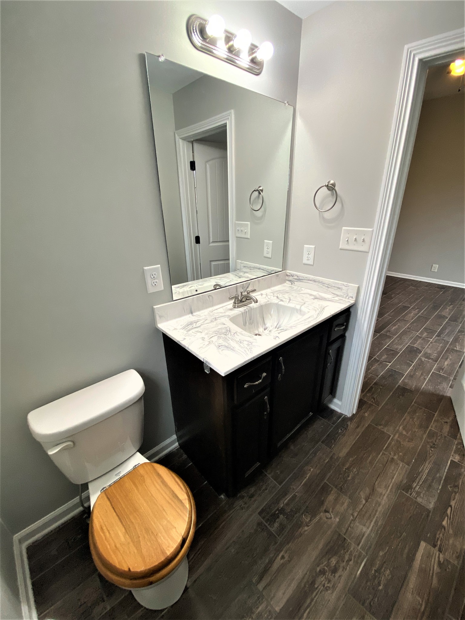 4200 Station Road Cunningham, TN 37052 - Photo 14 of 37 a bathroom with a sink vanity mirror and toilet