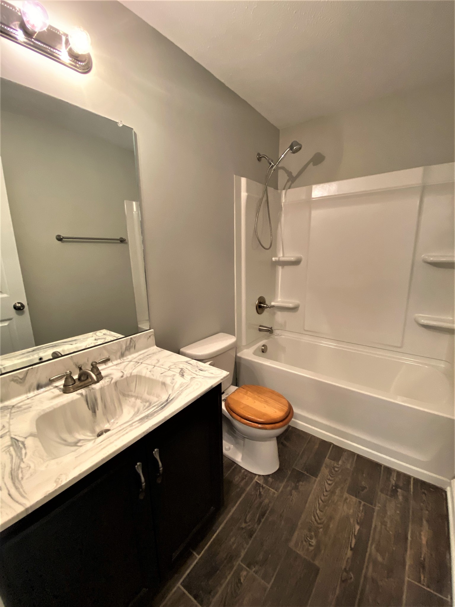 4200 Station Road Cunningham, TN 37052 - Photo 18 of 37 a bathroom with a sink a toilet and shower