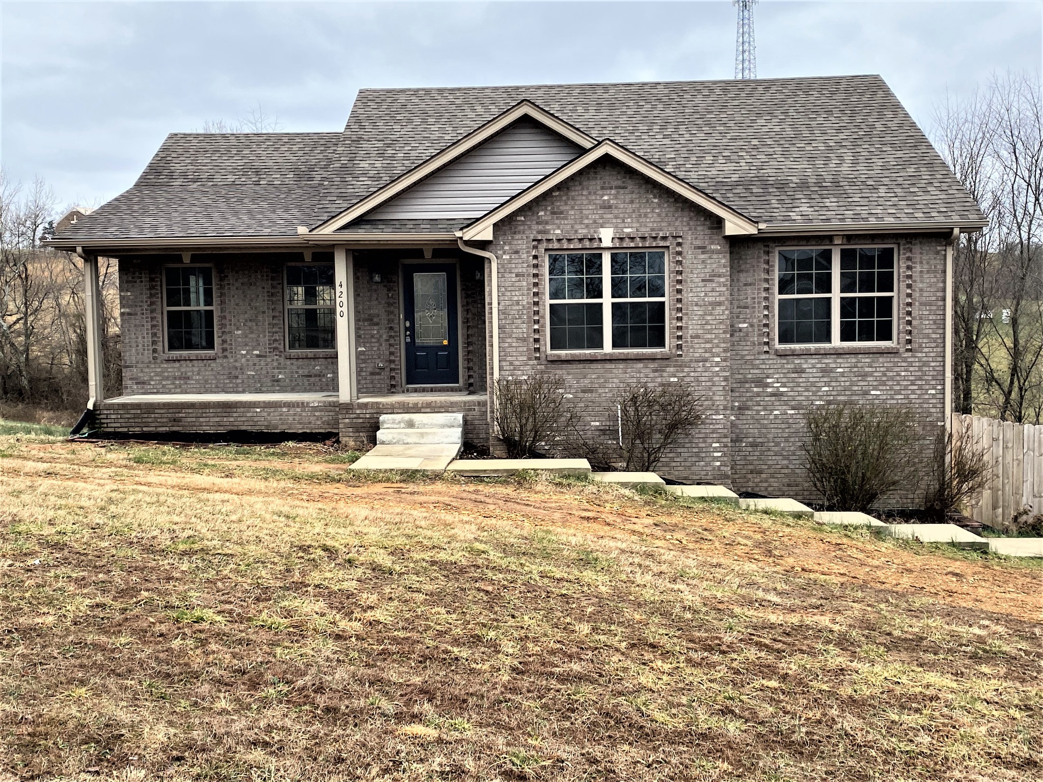 4200 Station Road Cunningham, TN 37052 - Photo 2 of 37 a front view of a house with a yard