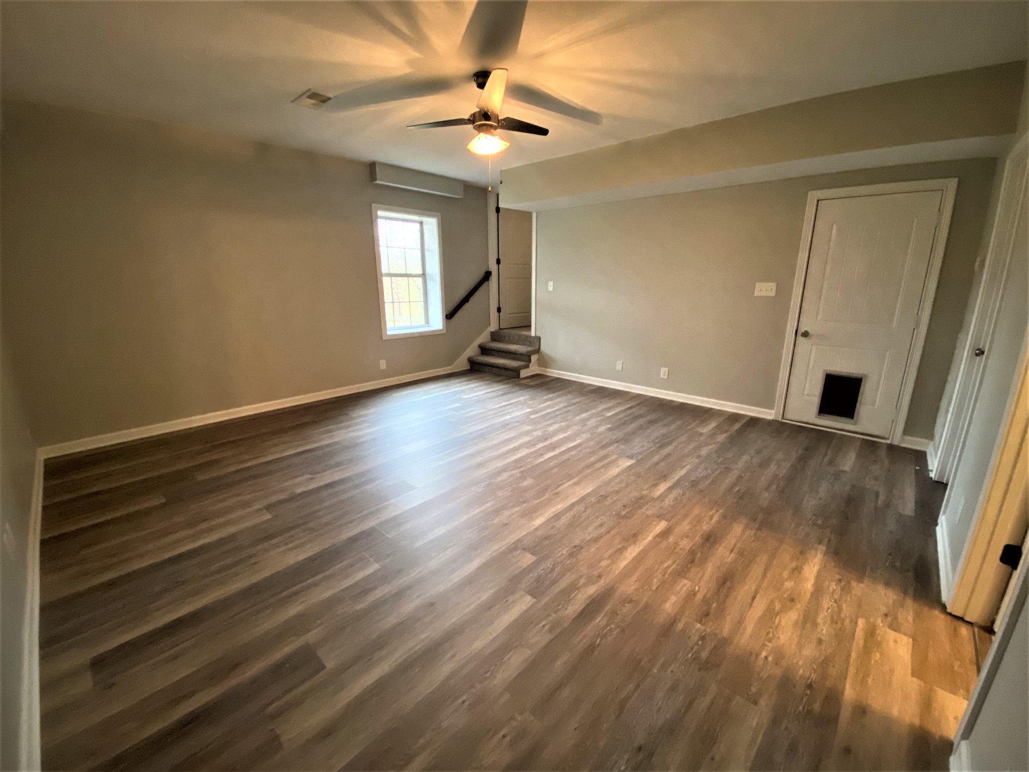 4200 Station Road Cunningham, TN 37052 - Photo 24 of 37 wooden floor in an empty room with a window