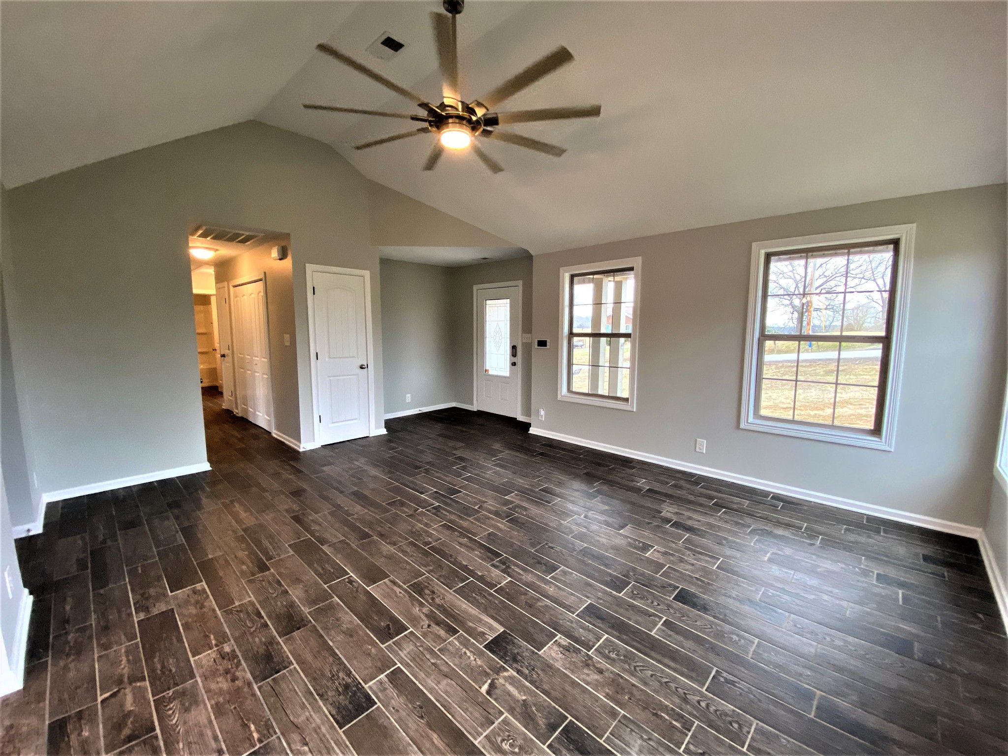 4200 Station Road Cunningham, TN 37052 - Photo 4 of 37 wooden floor in an empty room with a window