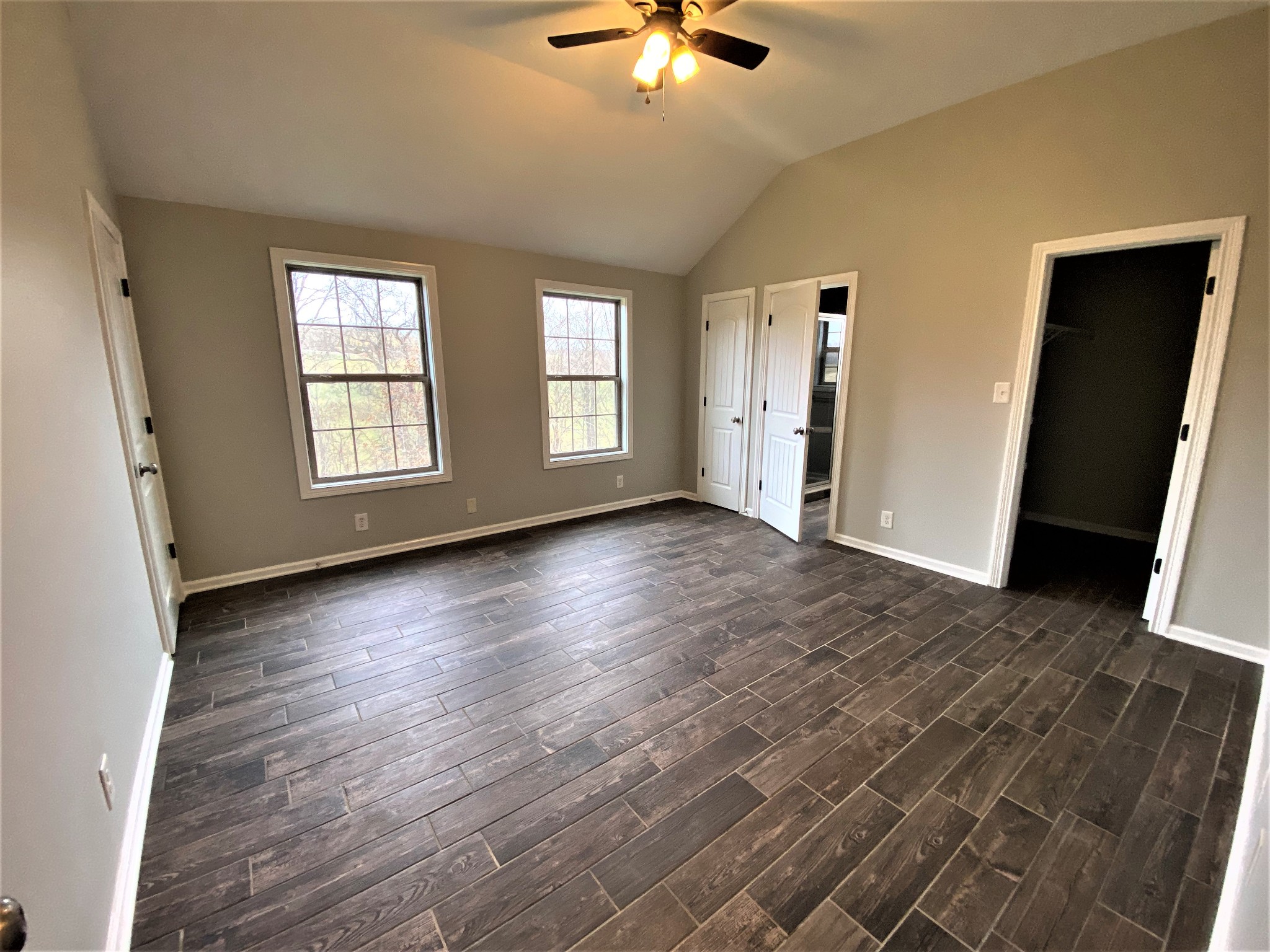 4200 Station Road Cunningham, TN 37052 - Photo 10 of 37 an empty room with wooden floor and windows
