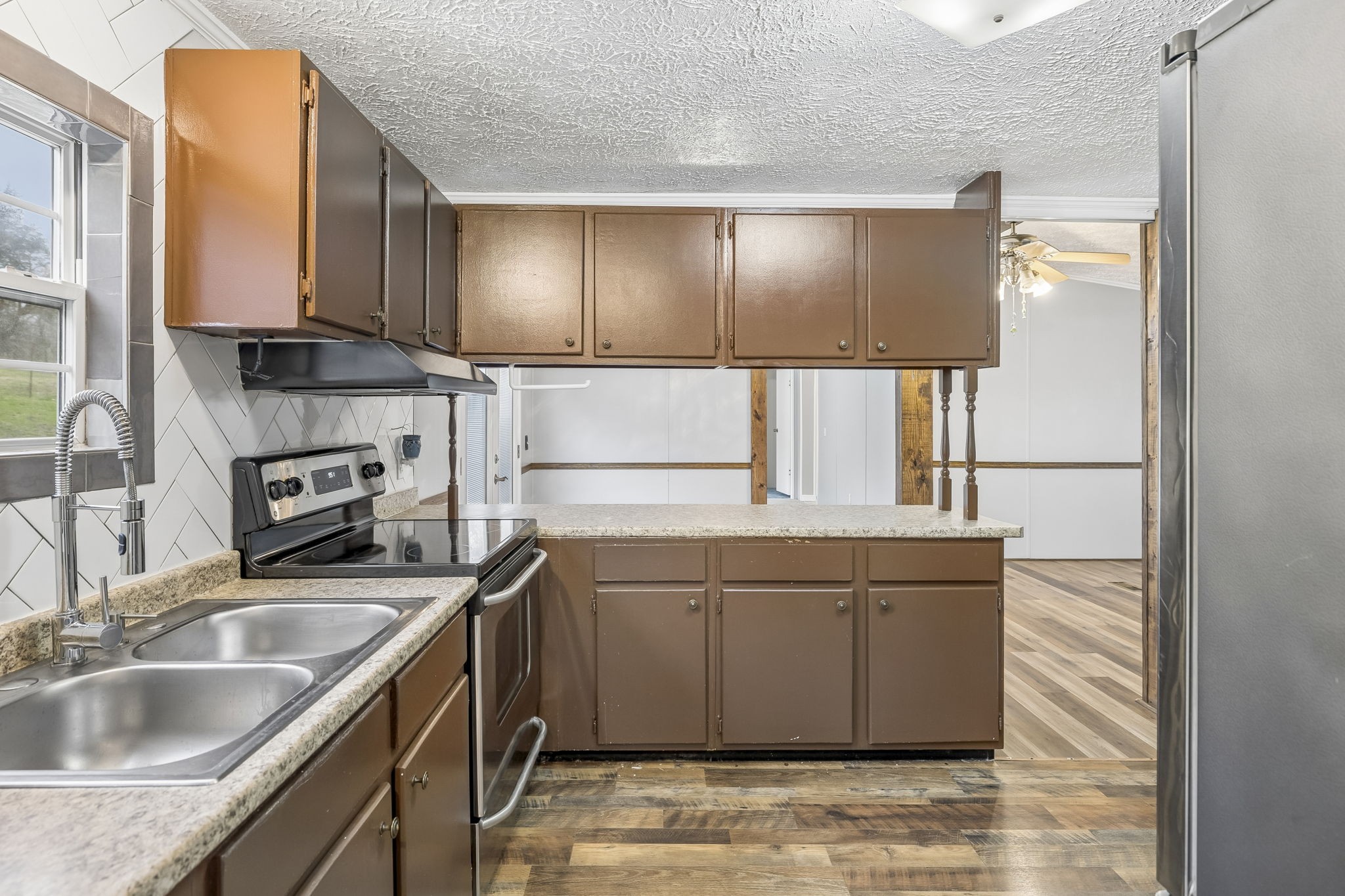 47 Riddleton Circle Riddleton, TN 37151 - Photo 12 of 46 a kitchen with a sink cabinets and window