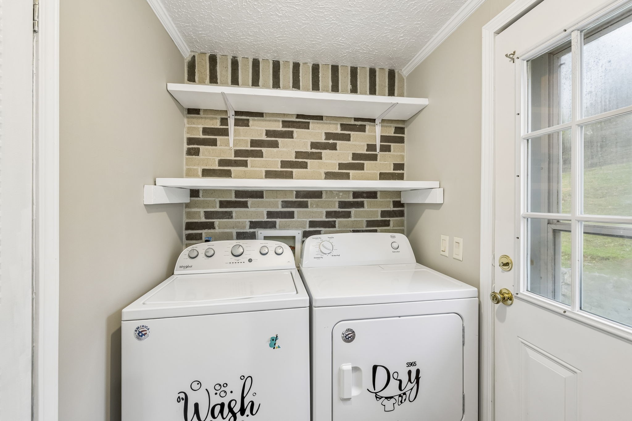 47 Riddleton Circle Riddleton, TN 37151 - Photo 13 of 46 a utility room with dryer and washer