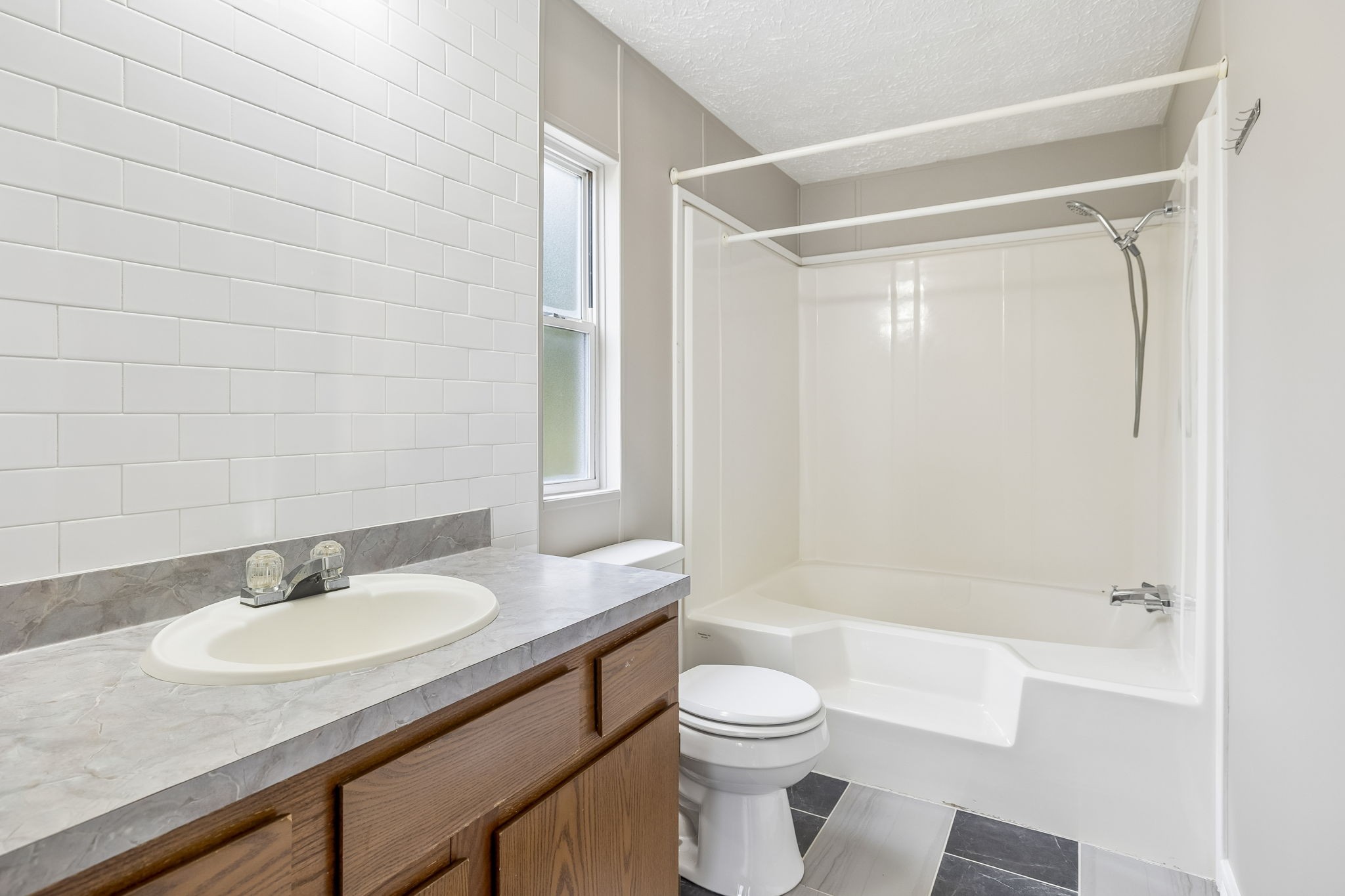 47 Riddleton Circle Riddleton, TN 37151 - Photo 16 of 46 a bathroom with a granite countertop sink toilet and shower