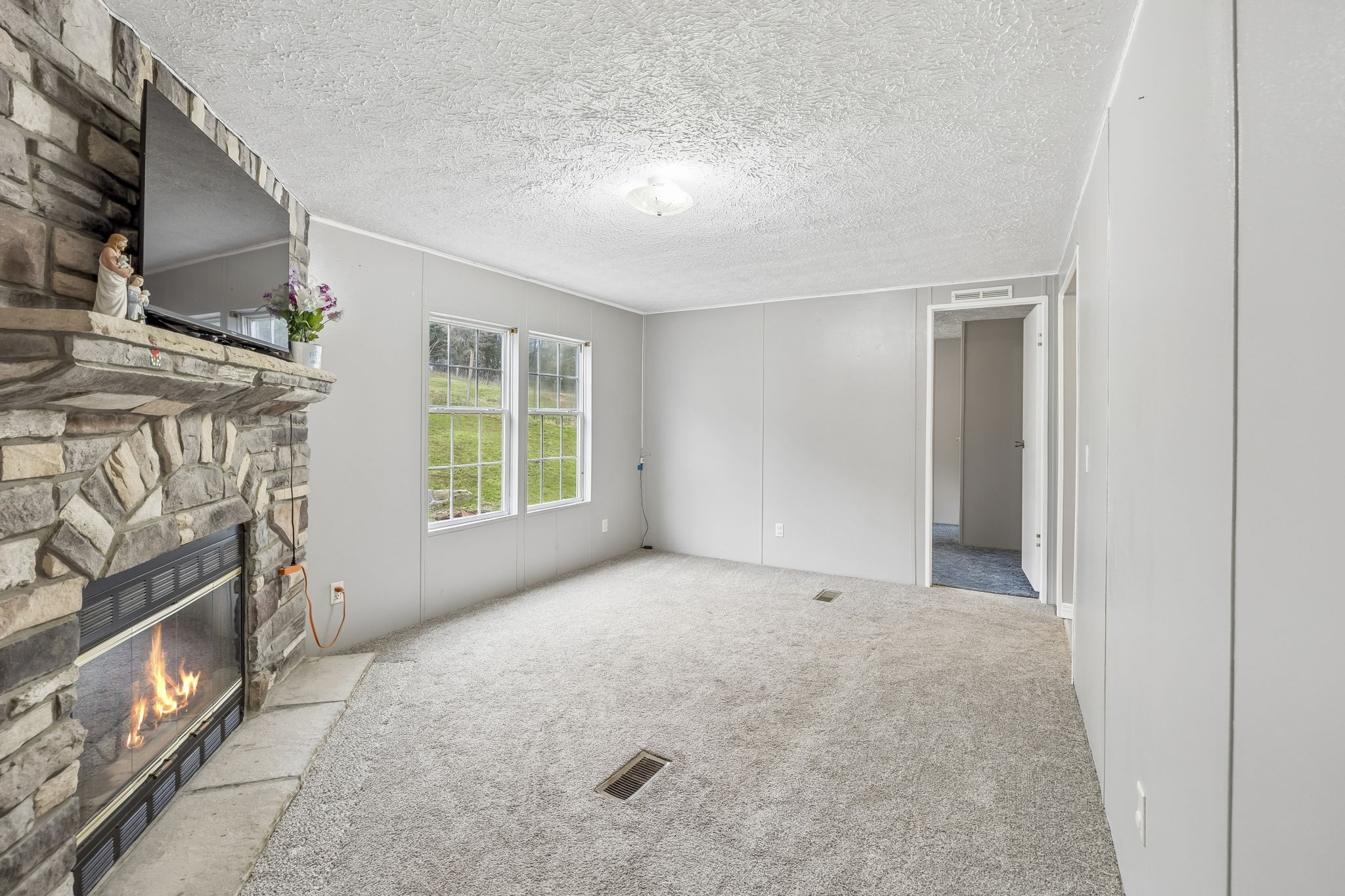 47 Riddleton Circle Riddleton, TN 37151 - Photo 18 of 46 a view of an empty room with a fireplace and a window