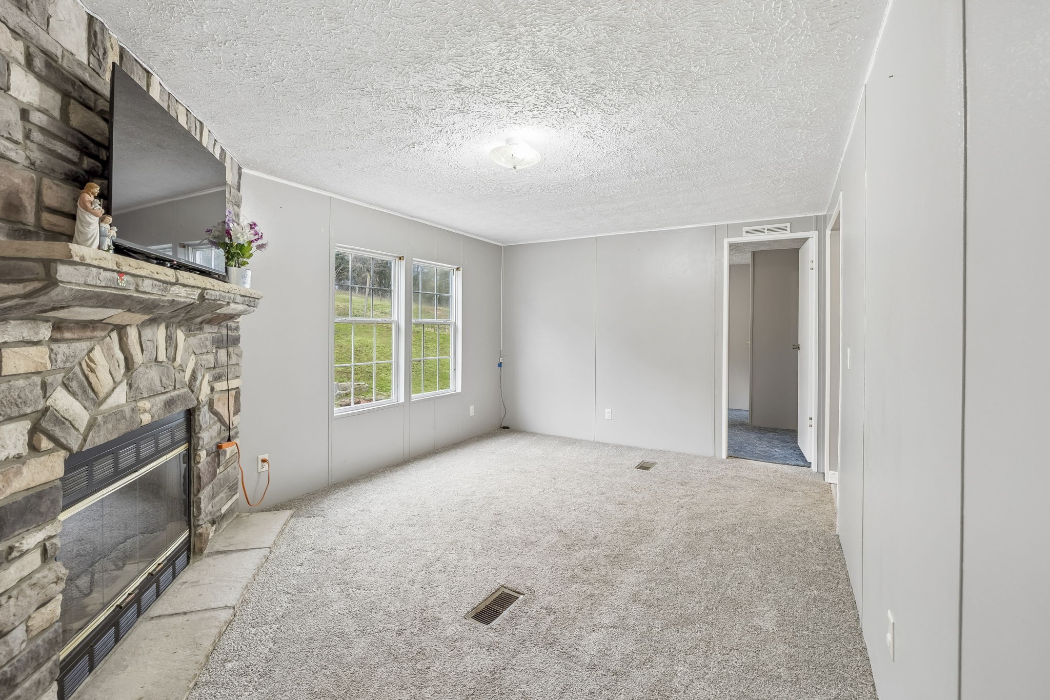 47 Riddleton Circle Riddleton, TN 37151 - Photo 19 of 46 a view of an empty room with a fireplace and a window