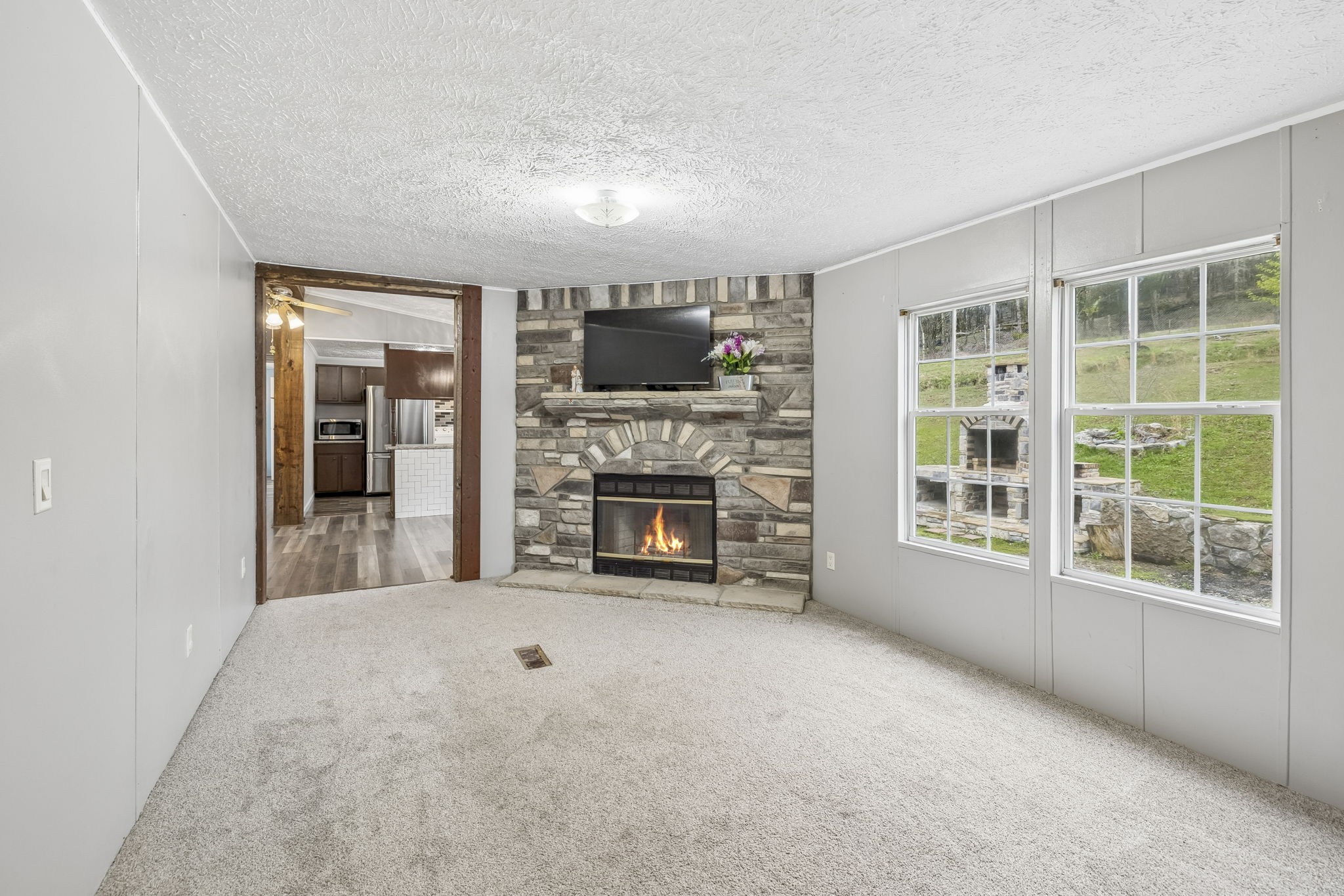 47 Riddleton Circle Riddleton, TN 37151 - Photo 20 of 46 a view of a livingroom with an empty space and a fireplace