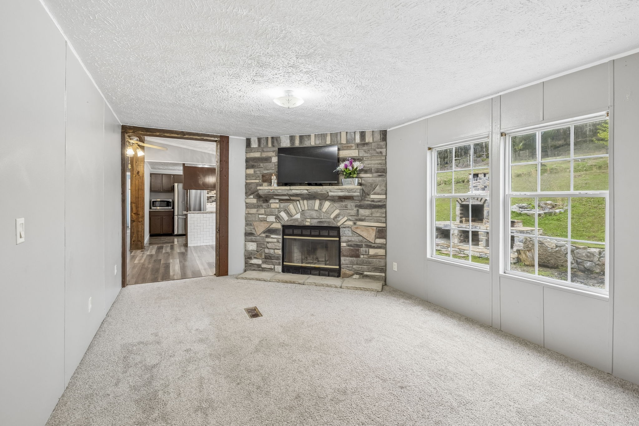 47 Riddleton Circle Riddleton, TN 37151 - Photo 21 of 46 a view of an empty room with a fireplace and a window