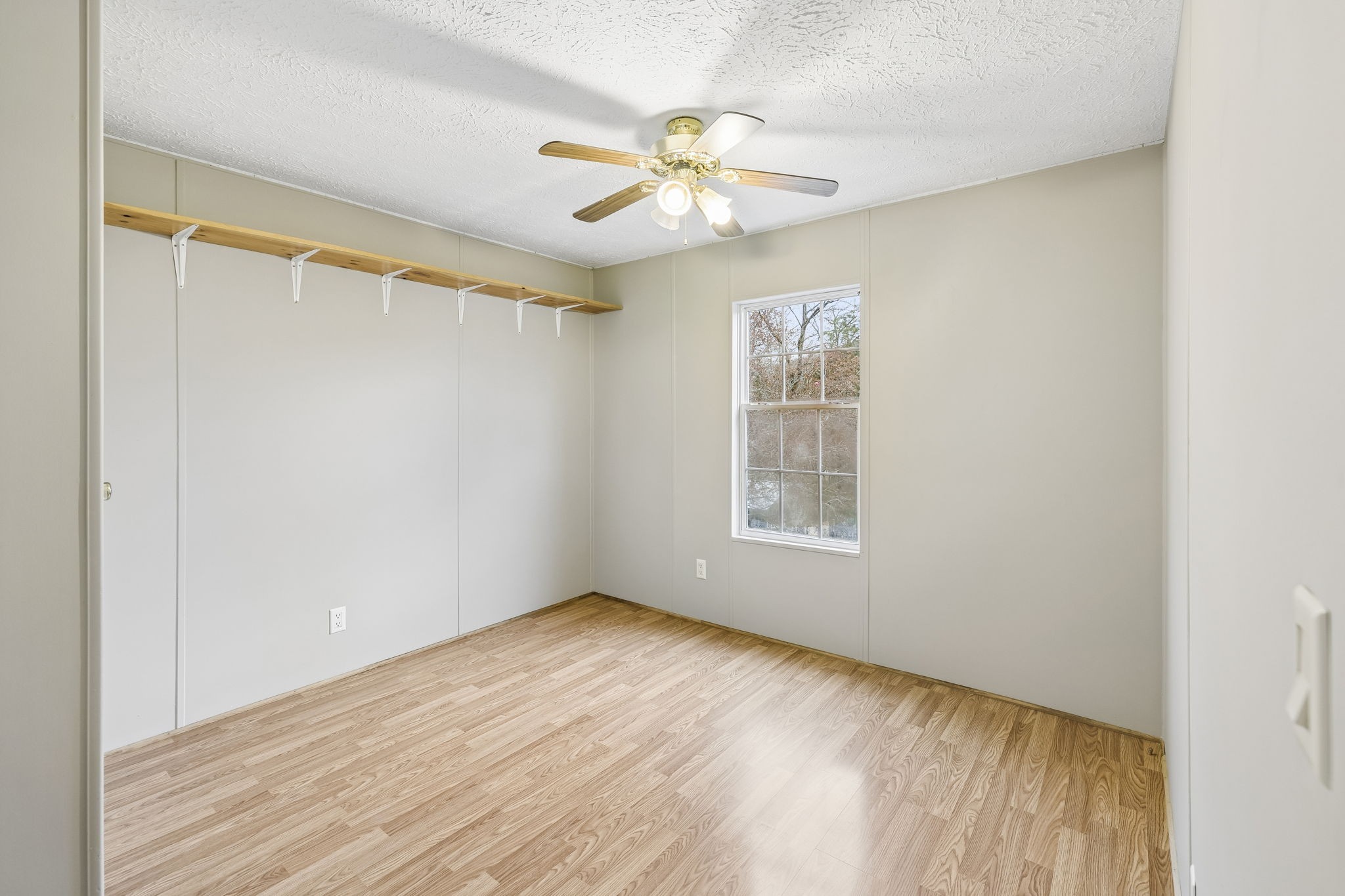 47 Riddleton Circle Riddleton, TN 37151 - Photo 25 of 46 a view of an empty room with wooden floor and a window