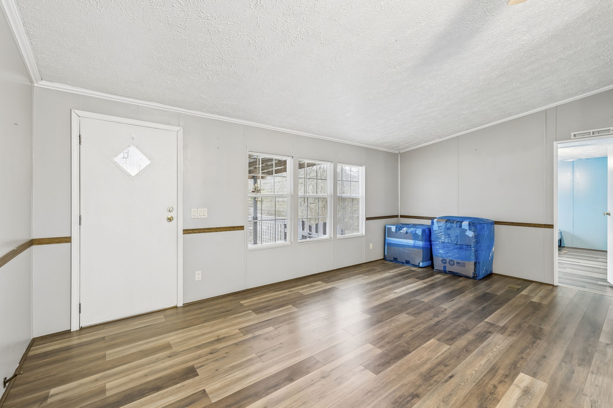 47 Riddleton Circle Riddleton, TN 37151 - Photo 4 of 46 a view of an empty room with wooden floor and a window