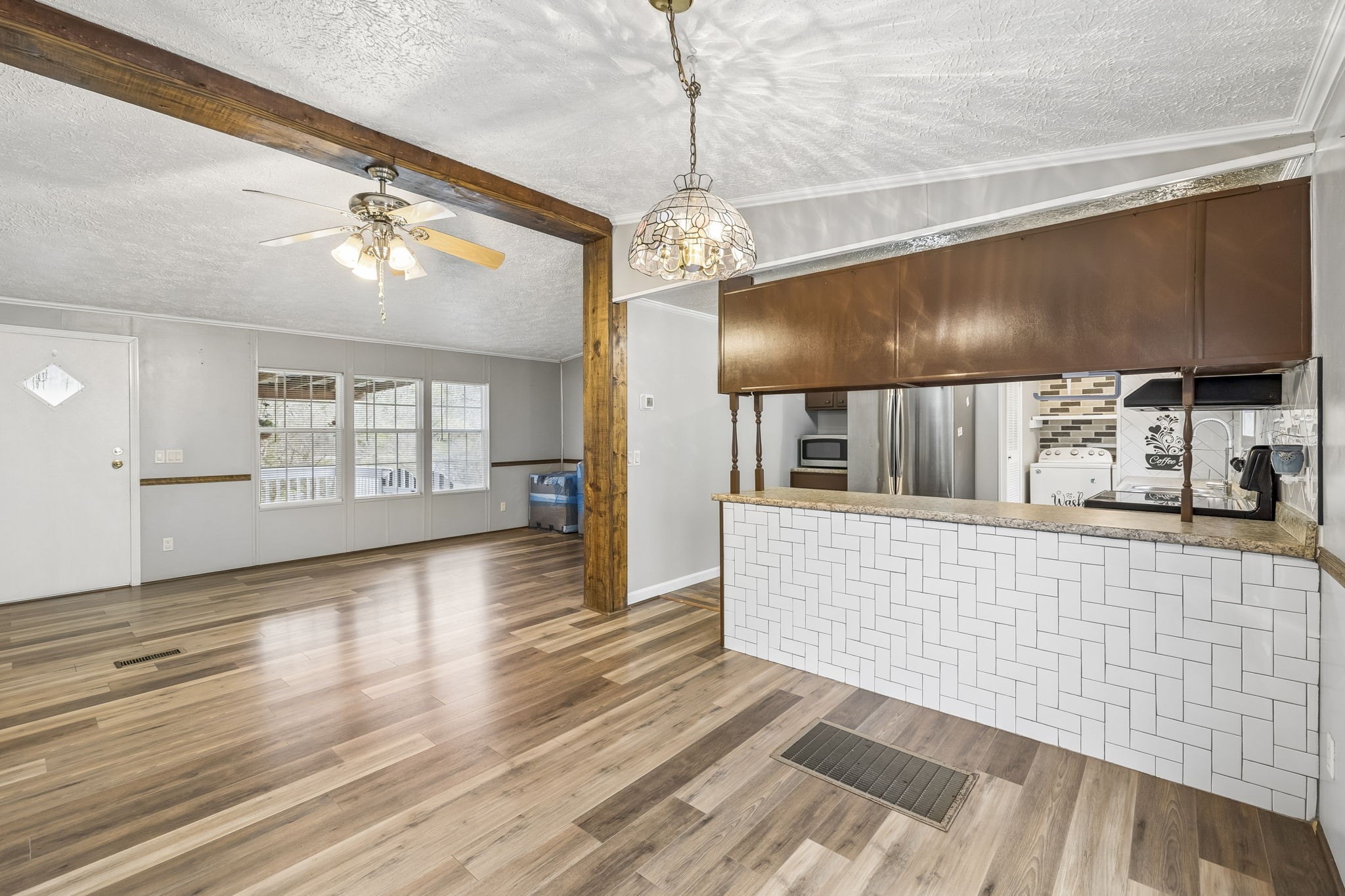 47 Riddleton Circle Riddleton, TN 37151 - Photo 9 of 46 a view of a living room with hardwood floor and a ceiling fan