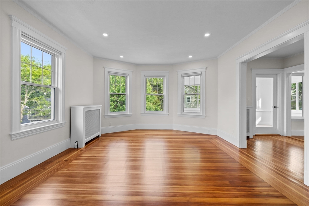 37 Fountain Road, Unit 2 Arlington, MA 02476 - Photo 2 of 25 a view of empty room with wooden floor and fan
