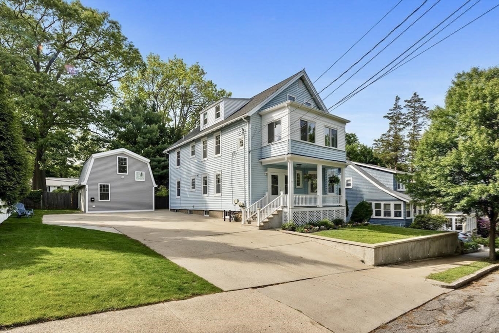 37 Fountain Road, Unit 2 Arlington, MA 02476 - Photo 25 of 25 a front view of a house with a garden