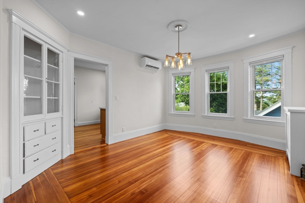 37 Fountain Road, Unit 2 Arlington, MA 02476 - Photo 5 of 25 a view of an empty room with window and wooden floor
