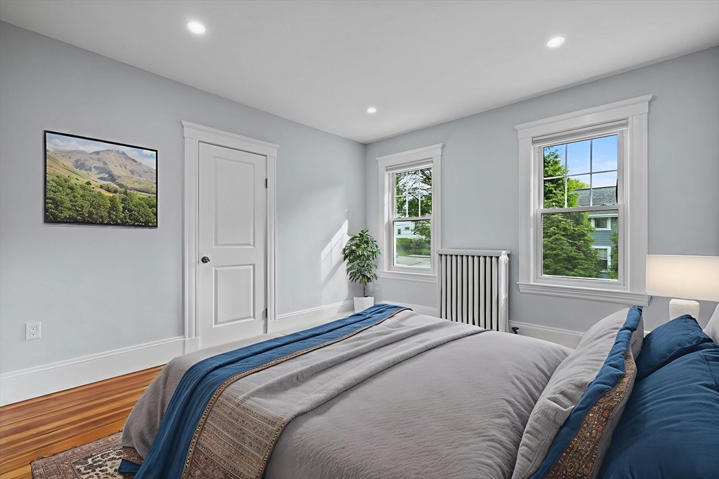 37 Fountain Road, Unit 2 Arlington, MA 02476 - Photo 10 of 25 a bedroom with a large bed and a window