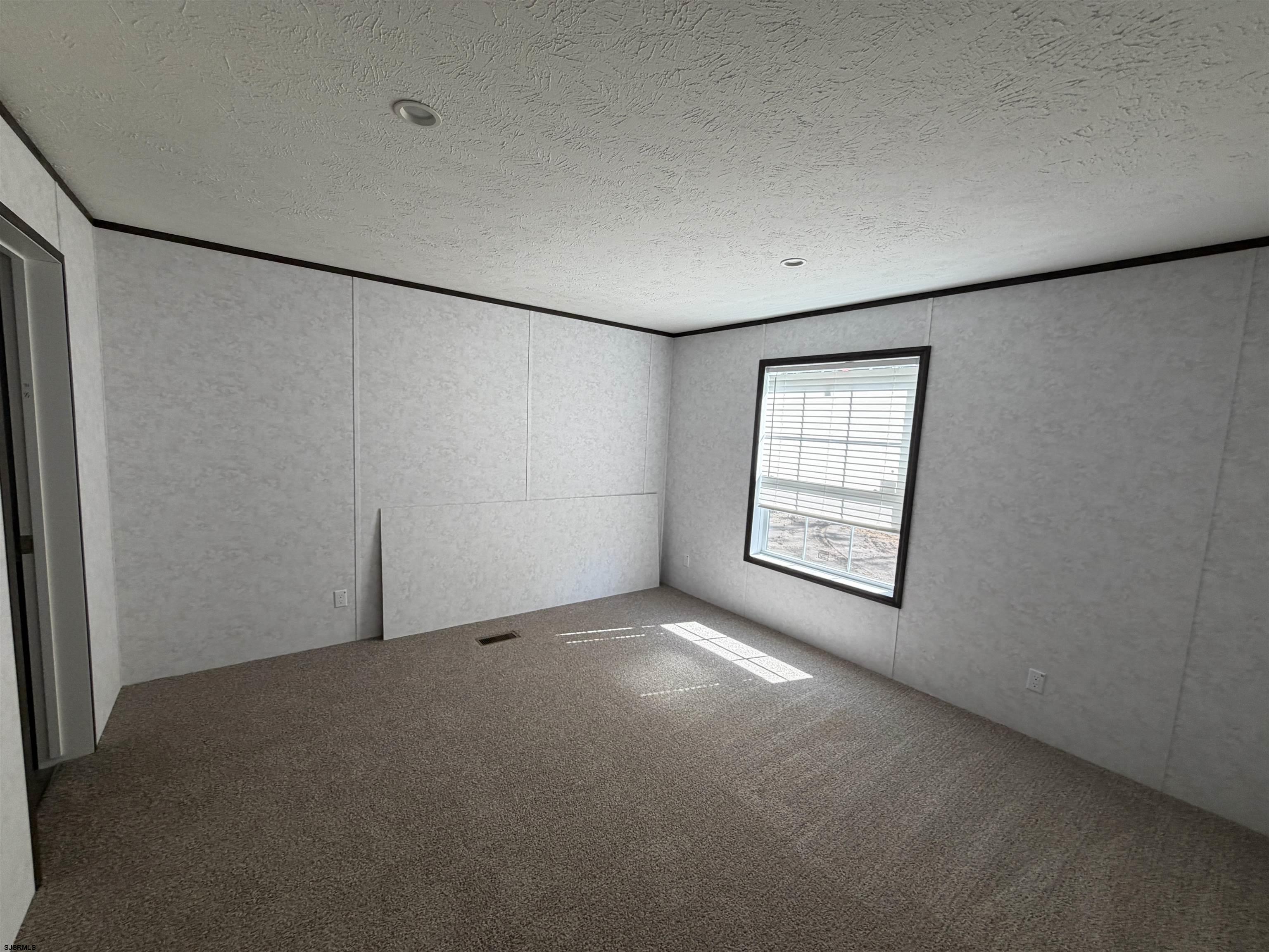 433 Poplar Road Laurel Lake, NJ 08332 - Photo 12 of 12 an empty room with windows