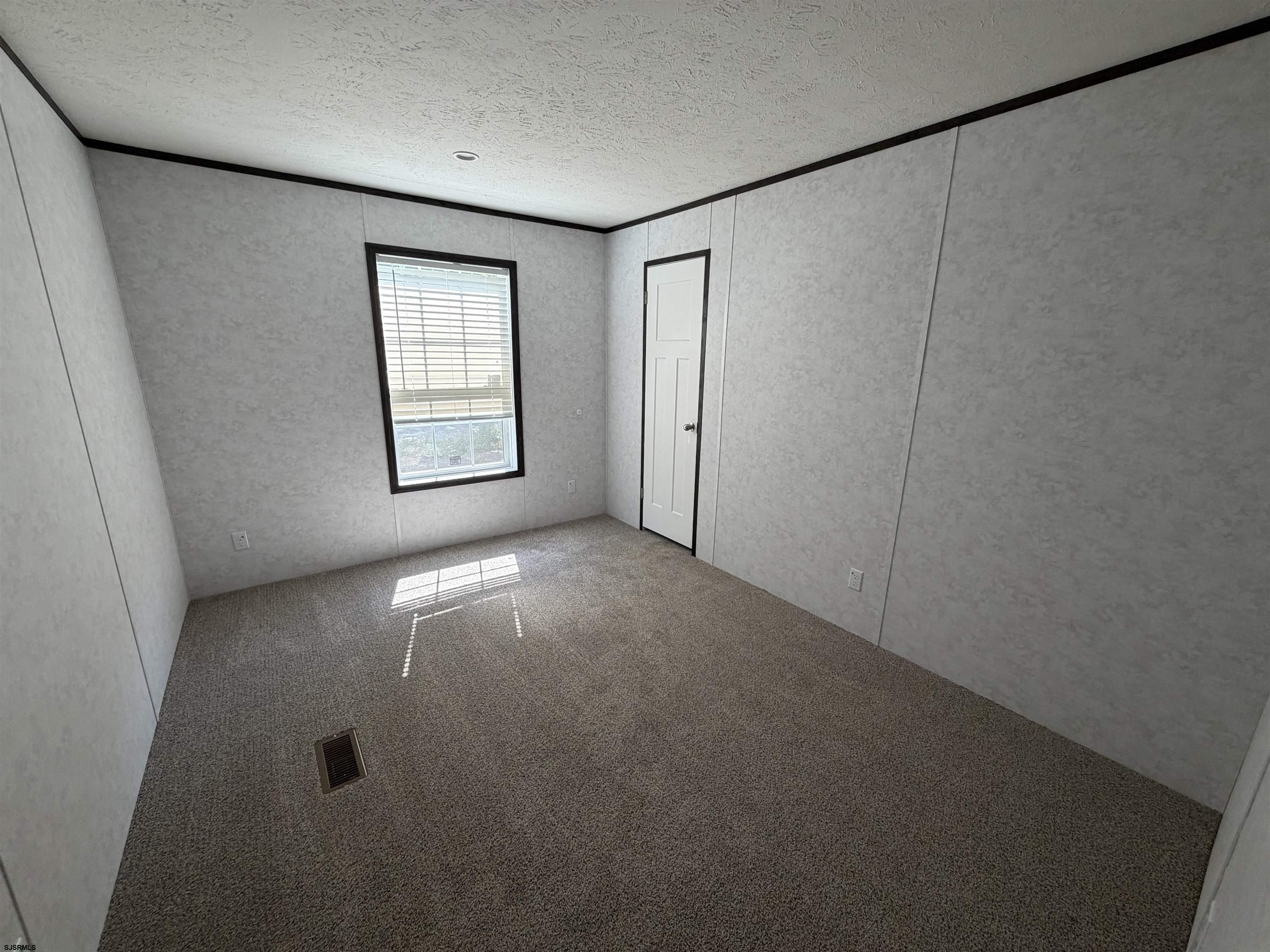 433 Poplar Road Laurel Lake, NJ 08332 - Photo 10 of 12 a view of empty room with windows