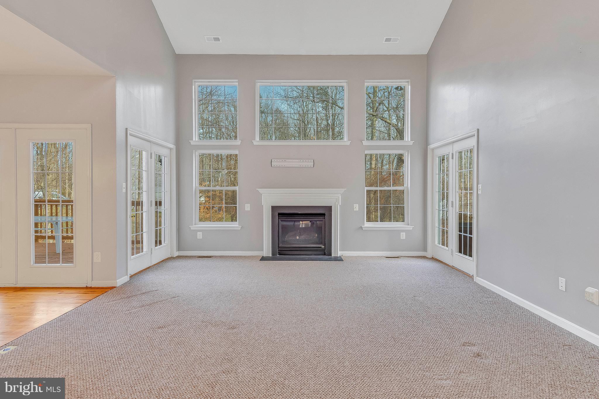 4613 Green Ridge Court Huntingtown, MD 20639 - Photo 4 of 29 Light filled 2 story family room w/gas fireplace