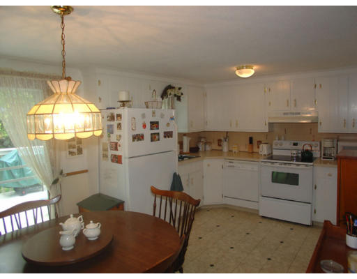 112 Knower Road Westminster, MA 01473 - Photo 4 of 10 a kitchen with a sink cabinets and window