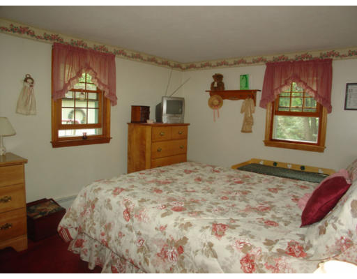 112 Knower Road Westminster, MA 01473 - Photo 9 of 10 a bedroom with a bed and a dresser next to a window