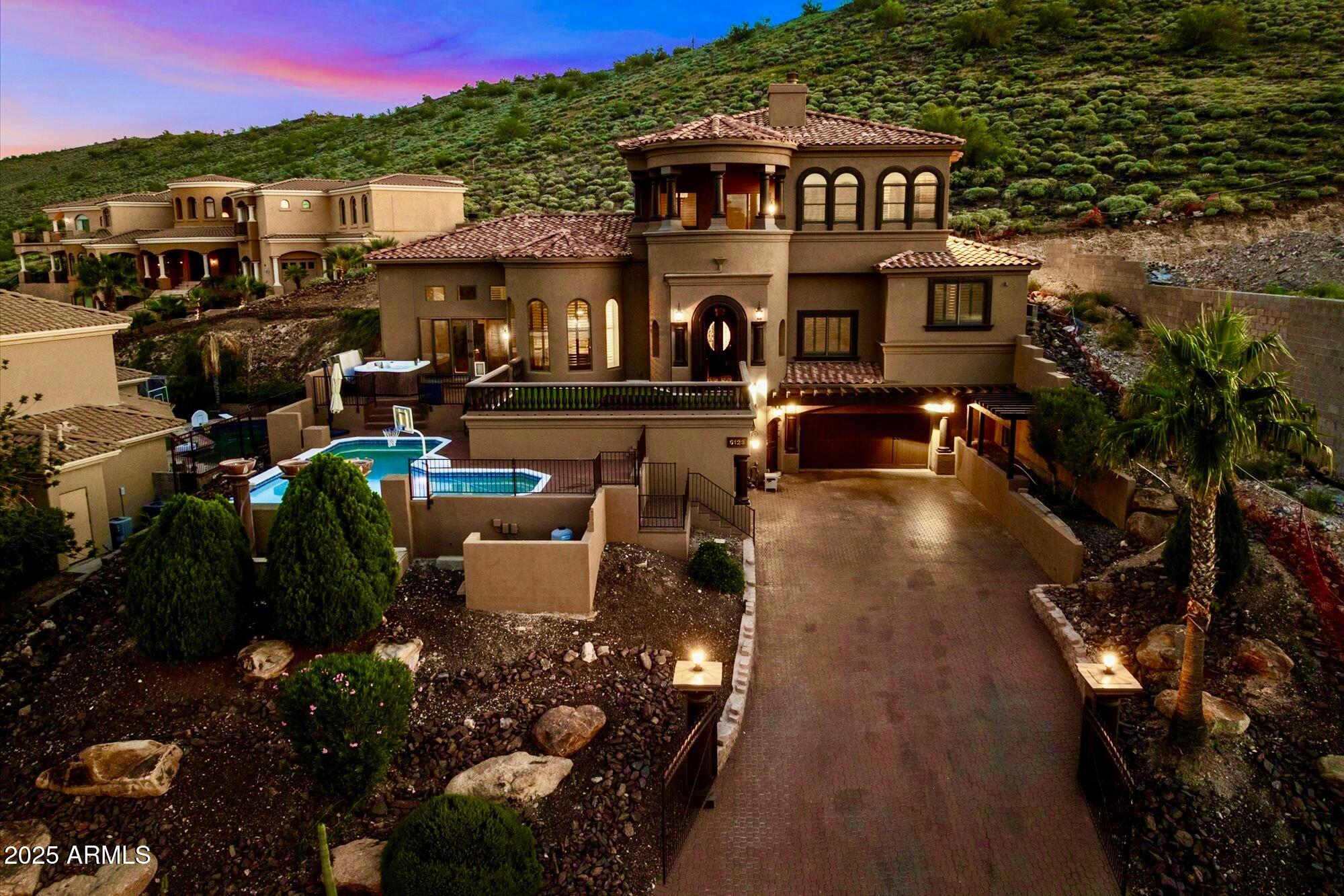 a view of a swimming pool with outdoor seating