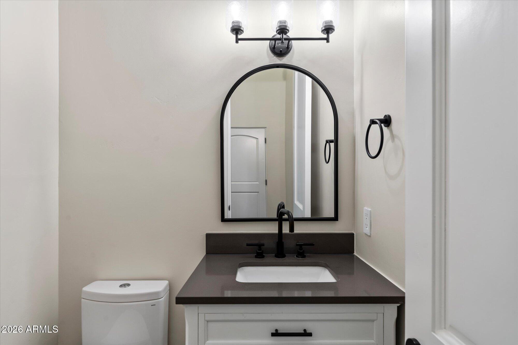 6123 West Alameda Road Glendale, AZ 85310 - Photo 21 of 39 a bathroom with a sink and a mirror