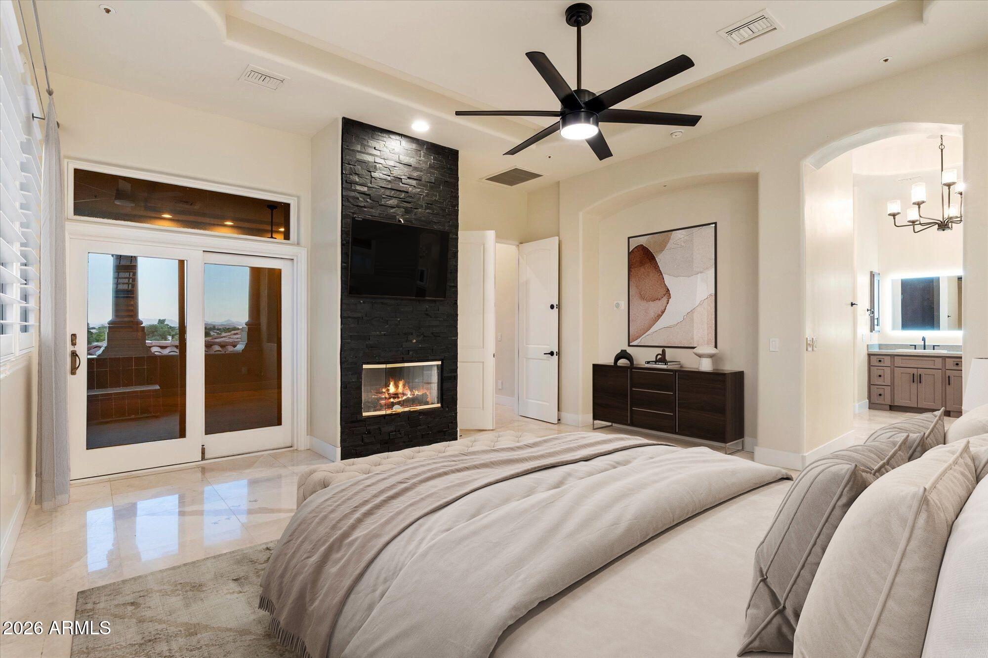 6123 West Alameda Road Glendale, AZ 85310 - Photo 24 of 39 a bedroom with a large bed and a large mirror