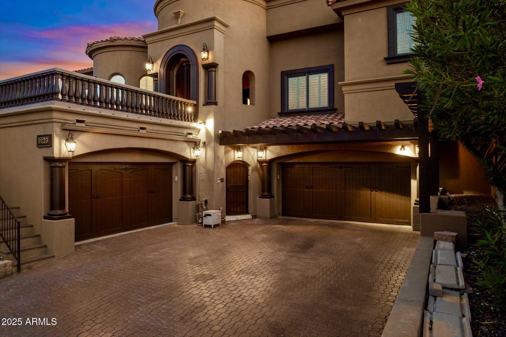 6123 West Alameda Road Glendale, AZ 85310 - Photo 3 of 8 a view of a building with a garage