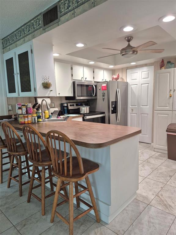 225 Country Club Drive, Unit C225 Largo, FL 33771 - Photo 12 of 26 a view of a dining area with furniture