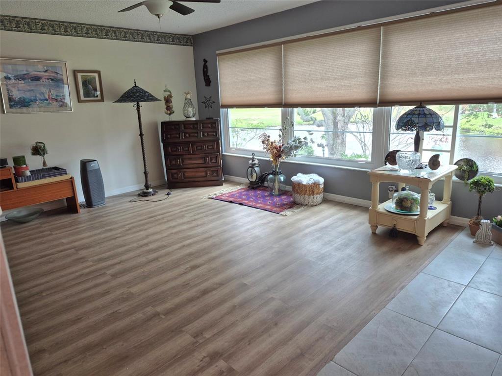 225 Country Club Drive, Unit C225 Largo, FL 33771 - Photo 6 of 26 a bedroom with furniture and a large window