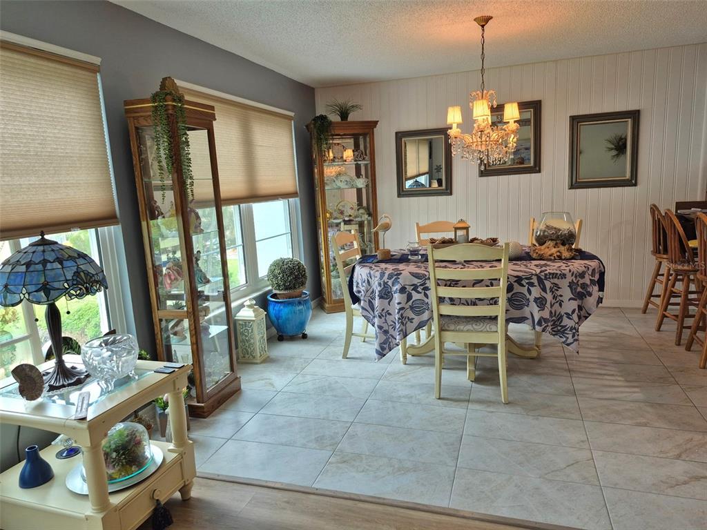 225 Country Club Drive, Unit C225 Largo, FL 33771 - Photo 7 of 26 a view of a dining room with furniture window and outside view