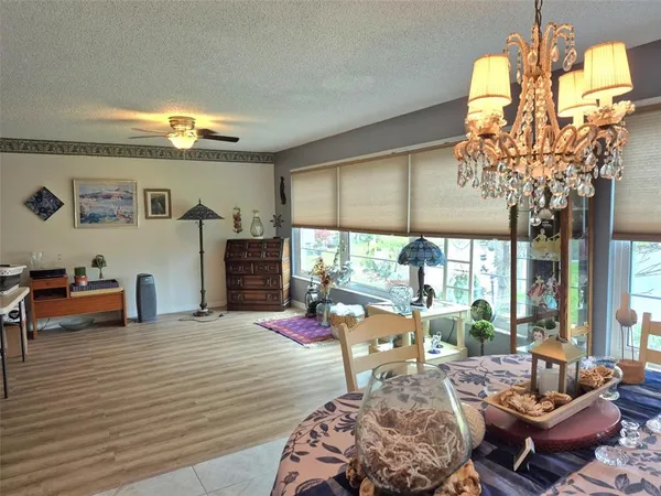 a living room filled with furniture chandelier and a chandelier