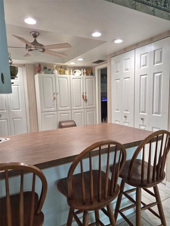 225 Country Club Drive, Unit C225 Largo, FL 33771 - Photo 10 of 26 a view of a dining room with furniture