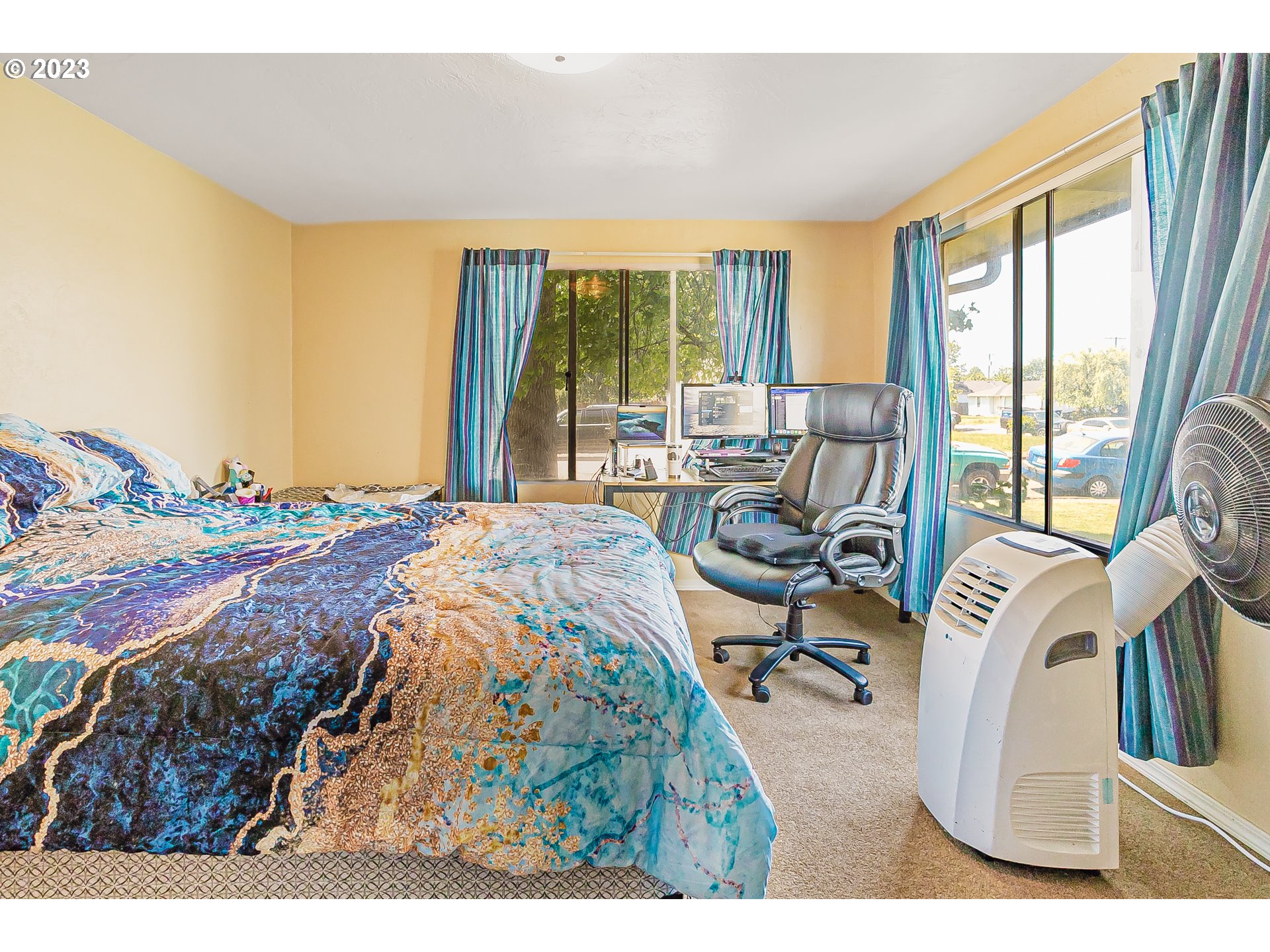465 North 24th Street Springfield, OR 97477 - Photo 15 of 30 a bed sitting in a bedroom next to a window